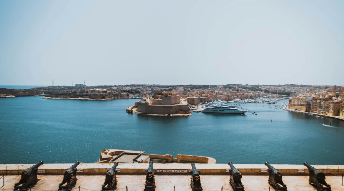 Photo by Kristina Paukshtite: https://www.pexels.com/photo/boat-on-body-of-water-dnear-concrete-building-1591250/