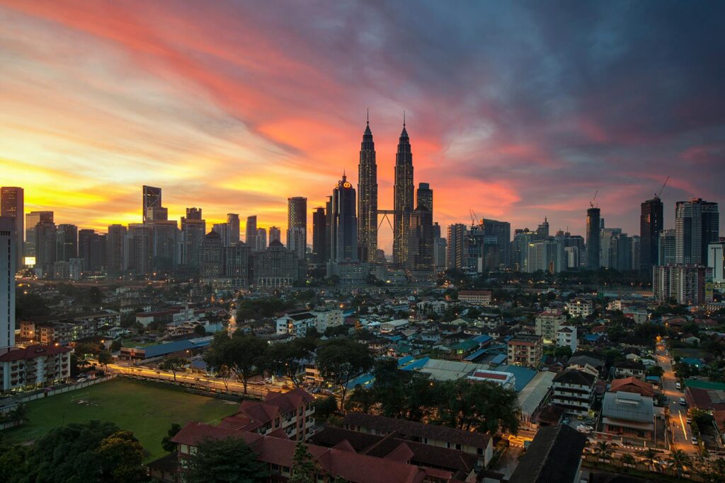 Photo by Zukiman Mohamad: https://www.pexels.com/photo/city-buildings-under-orange-sunset-94420/